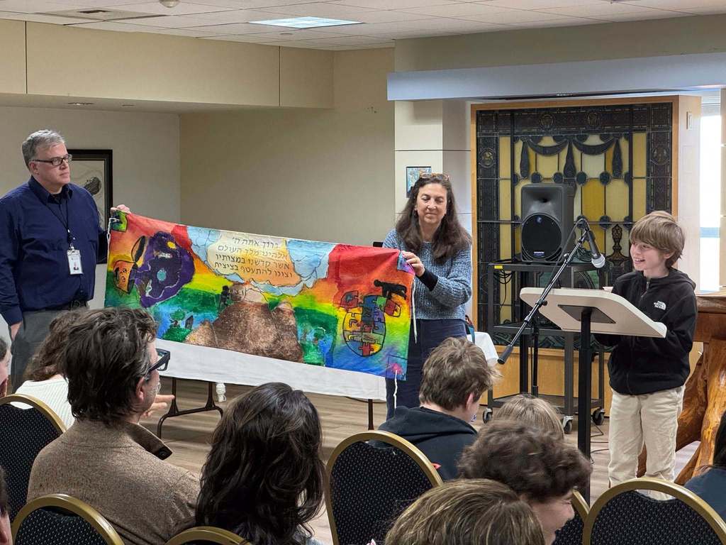 student presents his talit