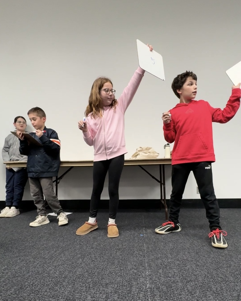 students write and show their answers — 5 —  in Hebrew language competition
