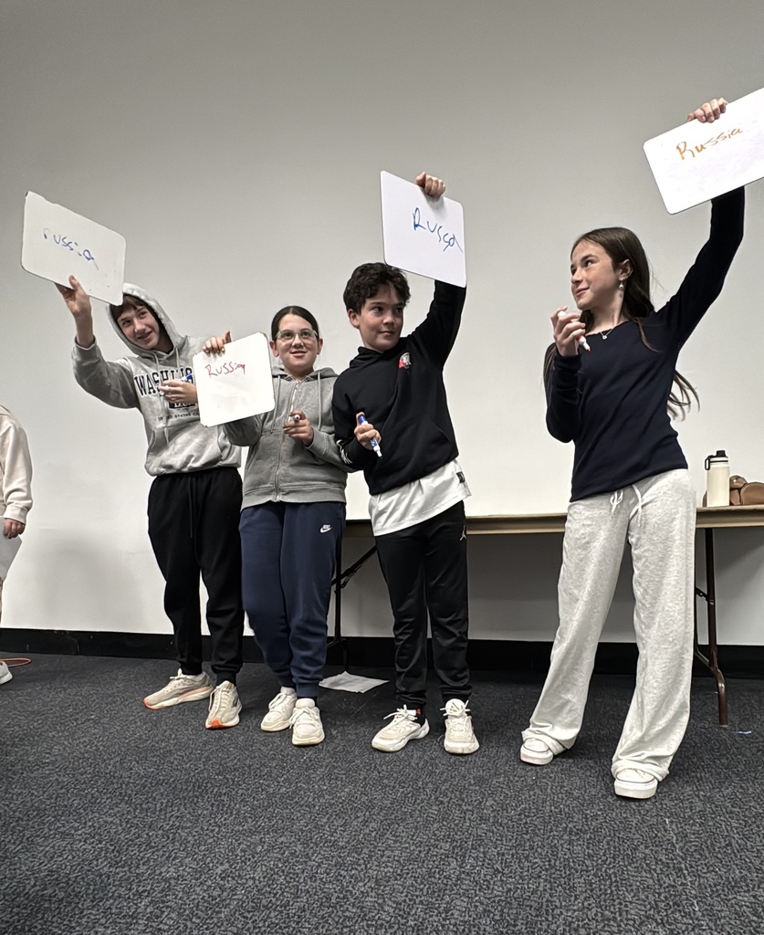 students show their answers — Russia —  in Hebrew language competition