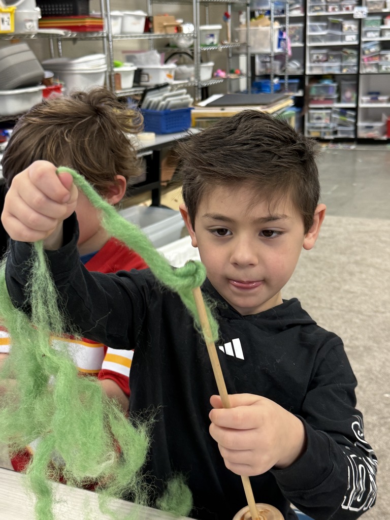 student spins wool