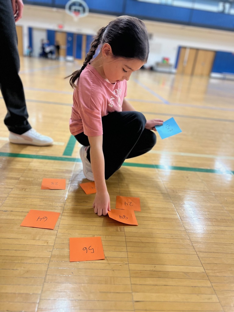 student picks the answer to her equation in Product Shuttle Run