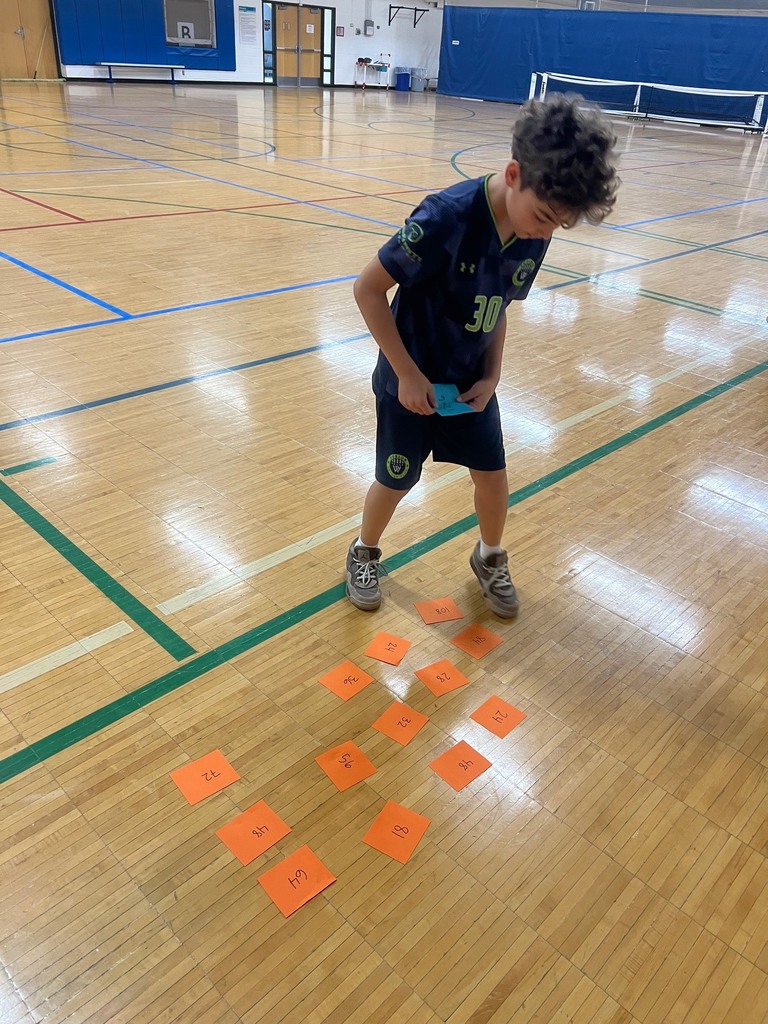 student picks the answer to her equation in Product Shuttle Run