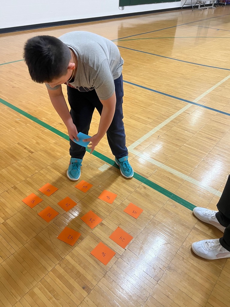 student picks the answer to her equation in Product Shuttle Run