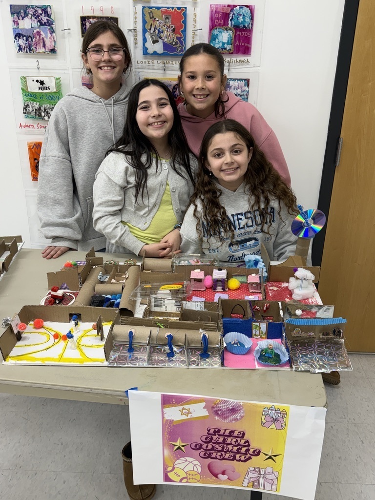 fifth grade students pose with their mars colony model