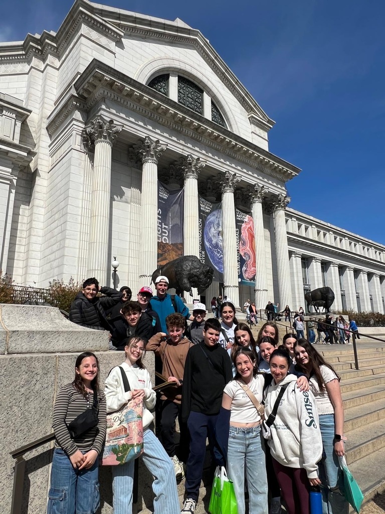 seventh grade students pose on the steps of the National Museum of Natural History in D.C.