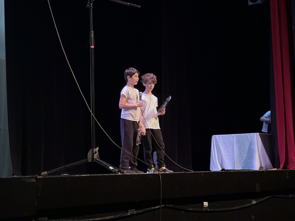 students speak on stage