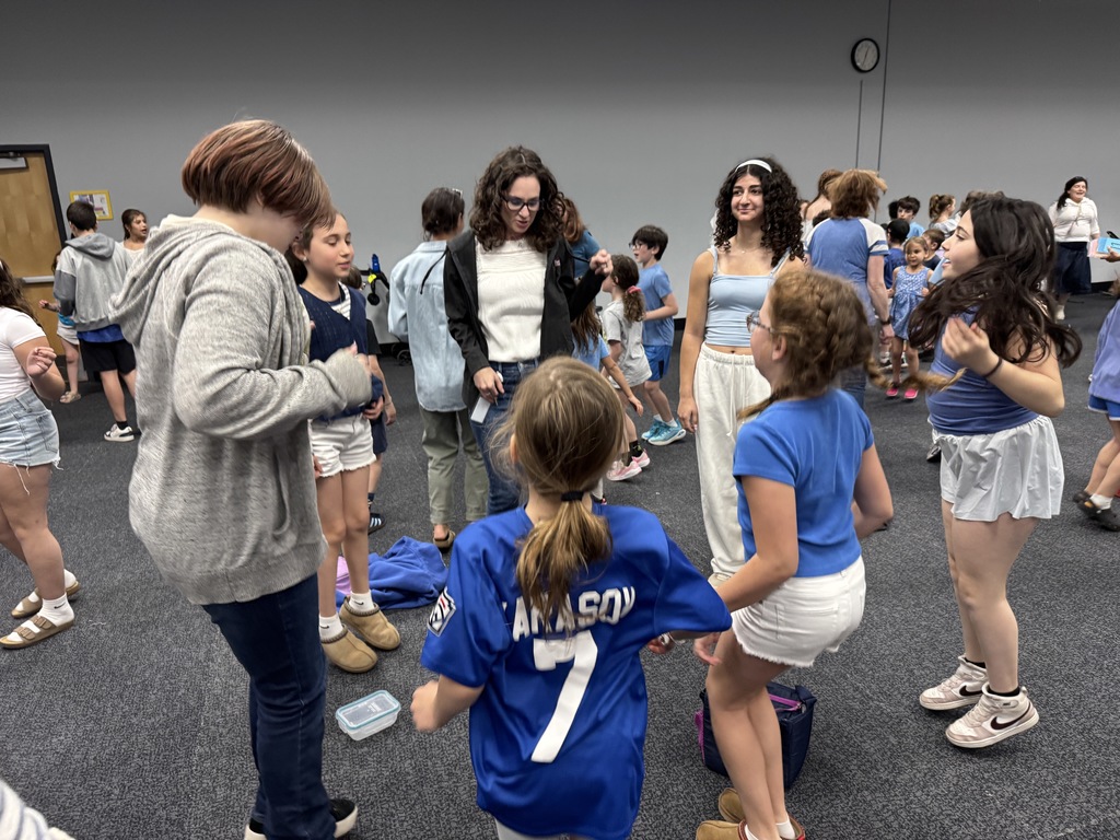 students and educator dance