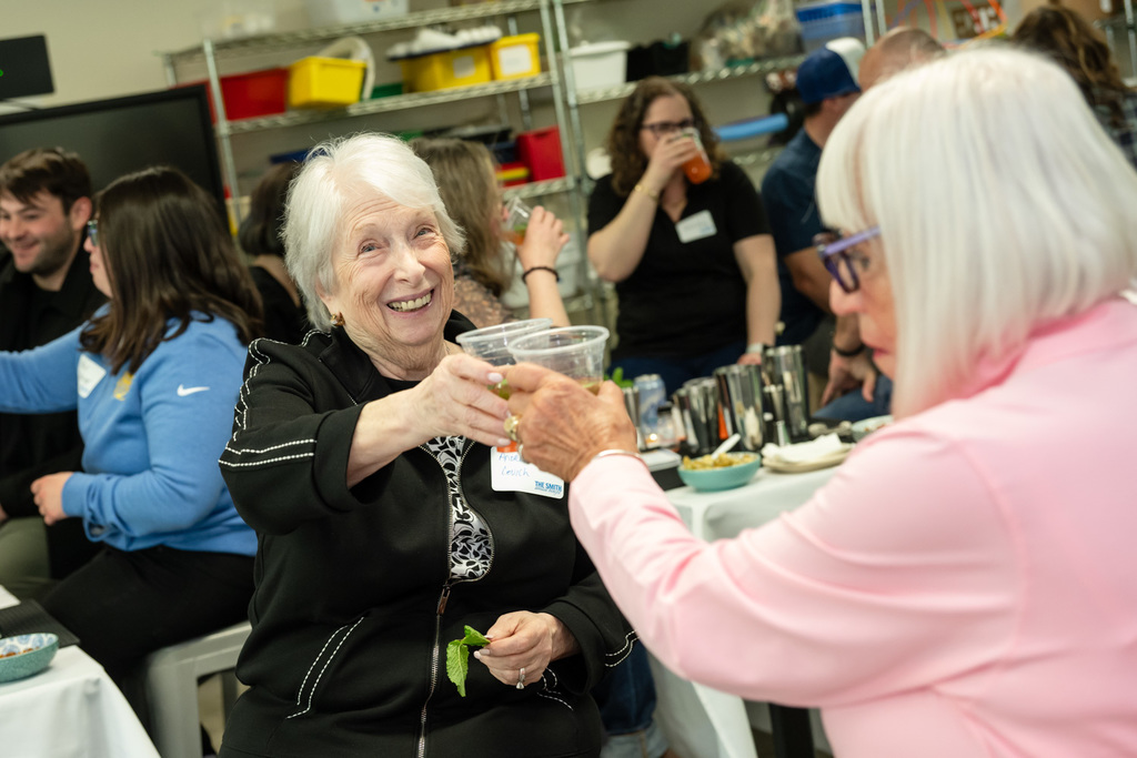 mixology participants clink cups