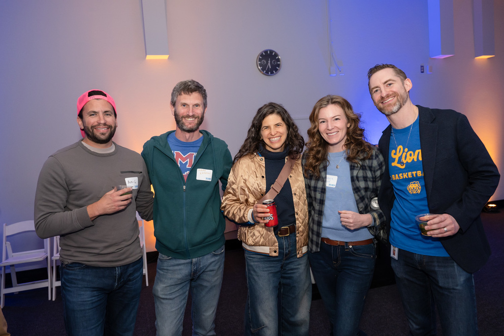 attendees pose together