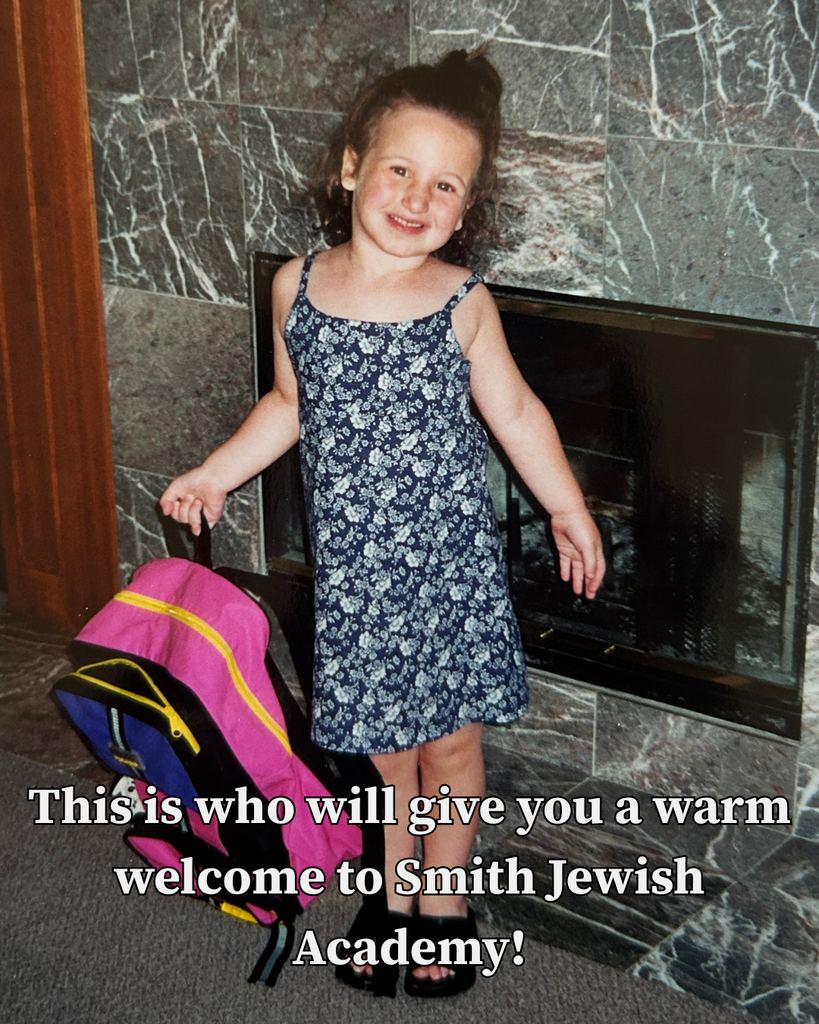 little girl holding backpack: This is who will give you a warm welcome to Smith Jewish Academy!