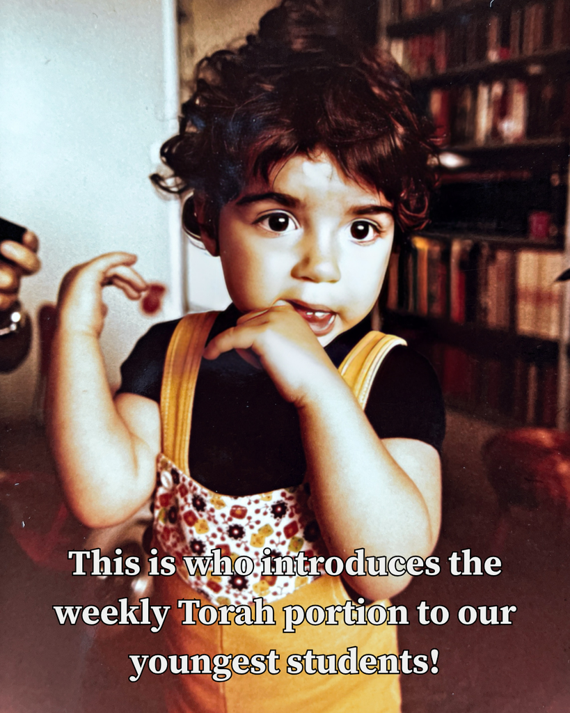 young girl in yellow overalls: this is who introduces the weekly Torah portion to our youngest students!