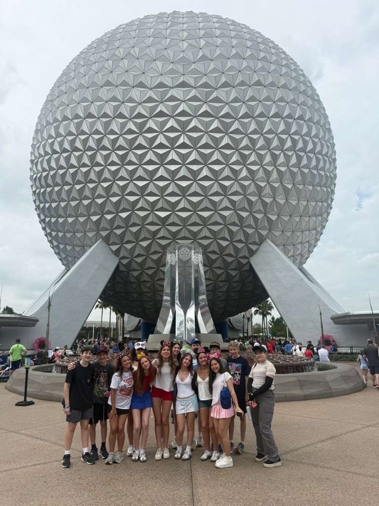 eighth grade class in front of Epcot's Spaceship Earth giant silver orb