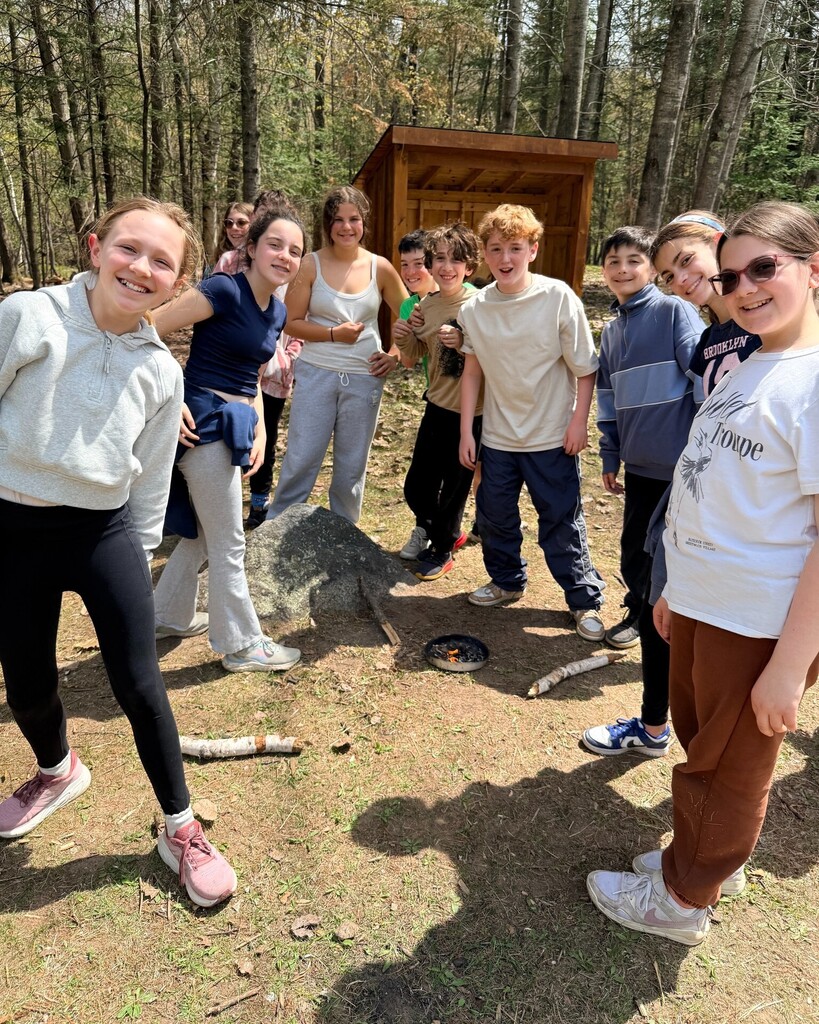 sixth graders around fire they created