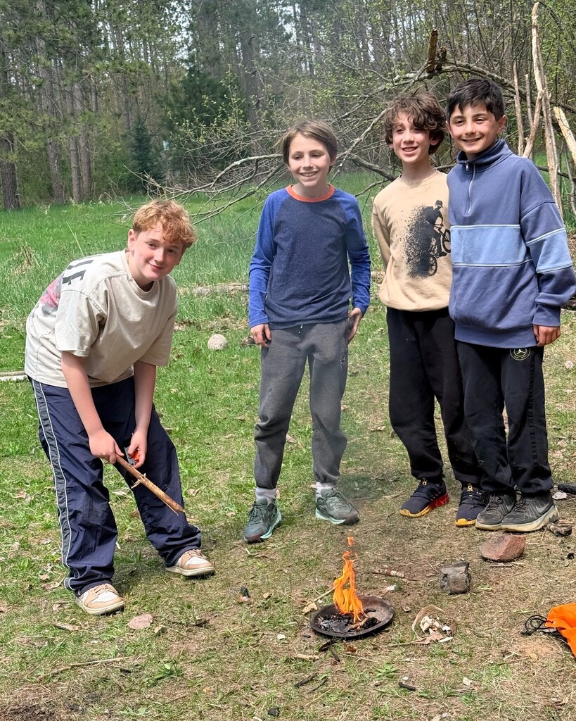 sixth graders around fire they created