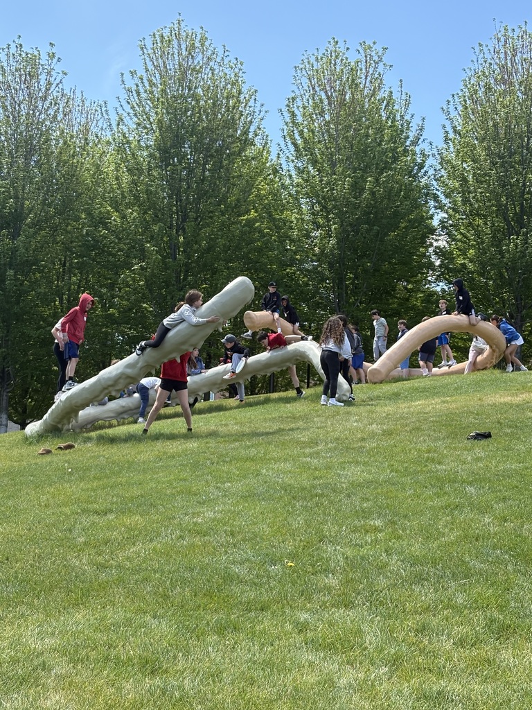 fifth graders climb Privileged Points sculptures