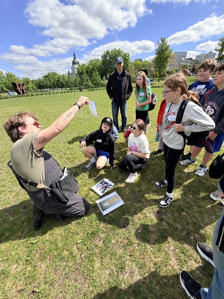 tour guide shows image to students