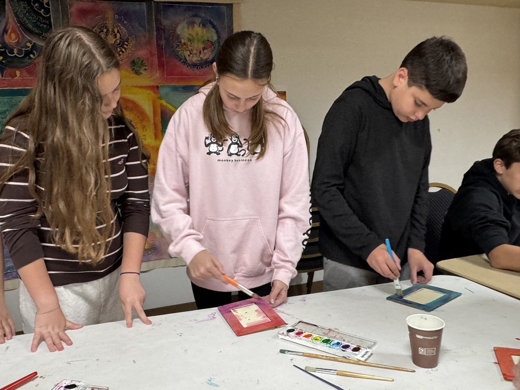 students paint frames