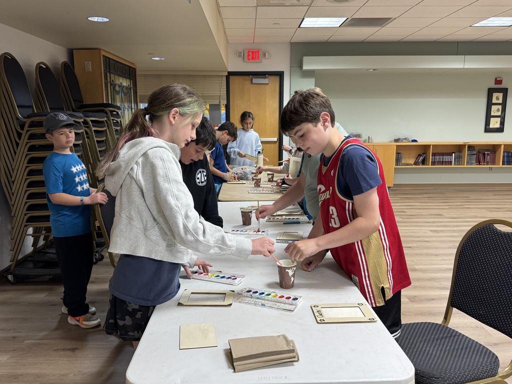 students paint frames