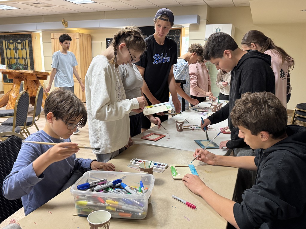 students paint frames