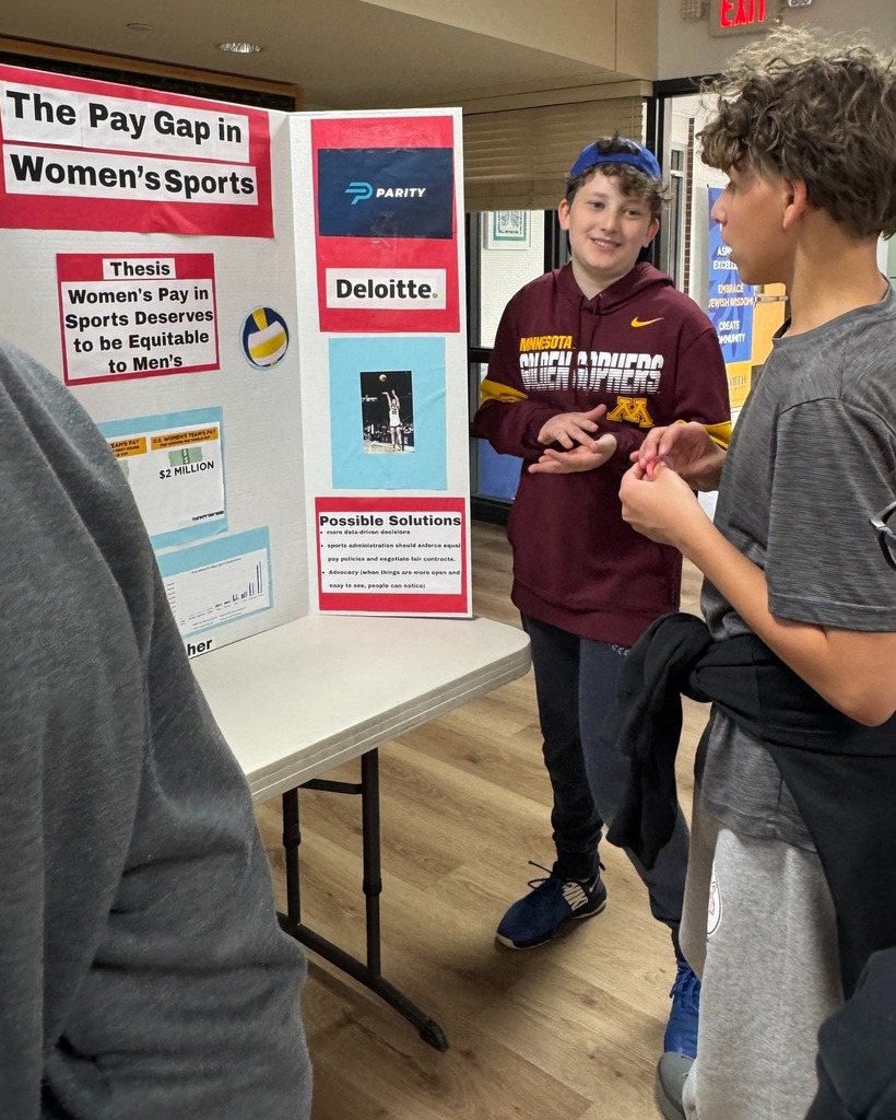 student presents poster with poster board