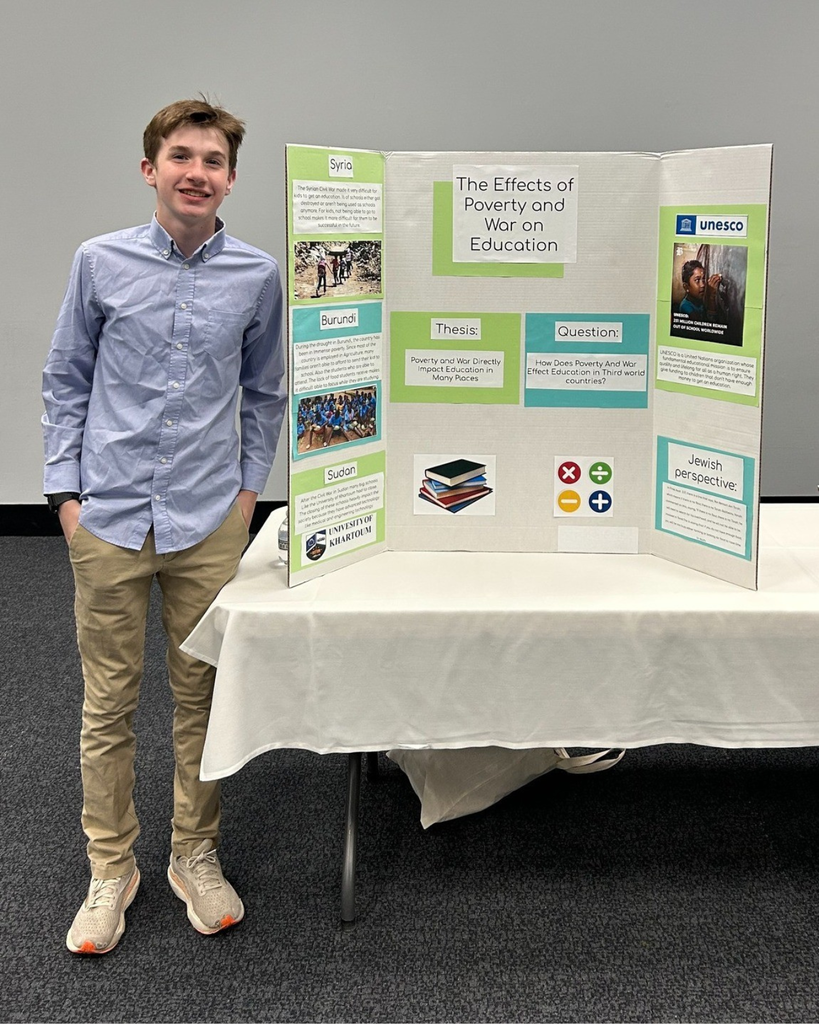 student with poster board