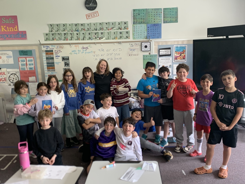 third grade students pose with author Dori Weinstein