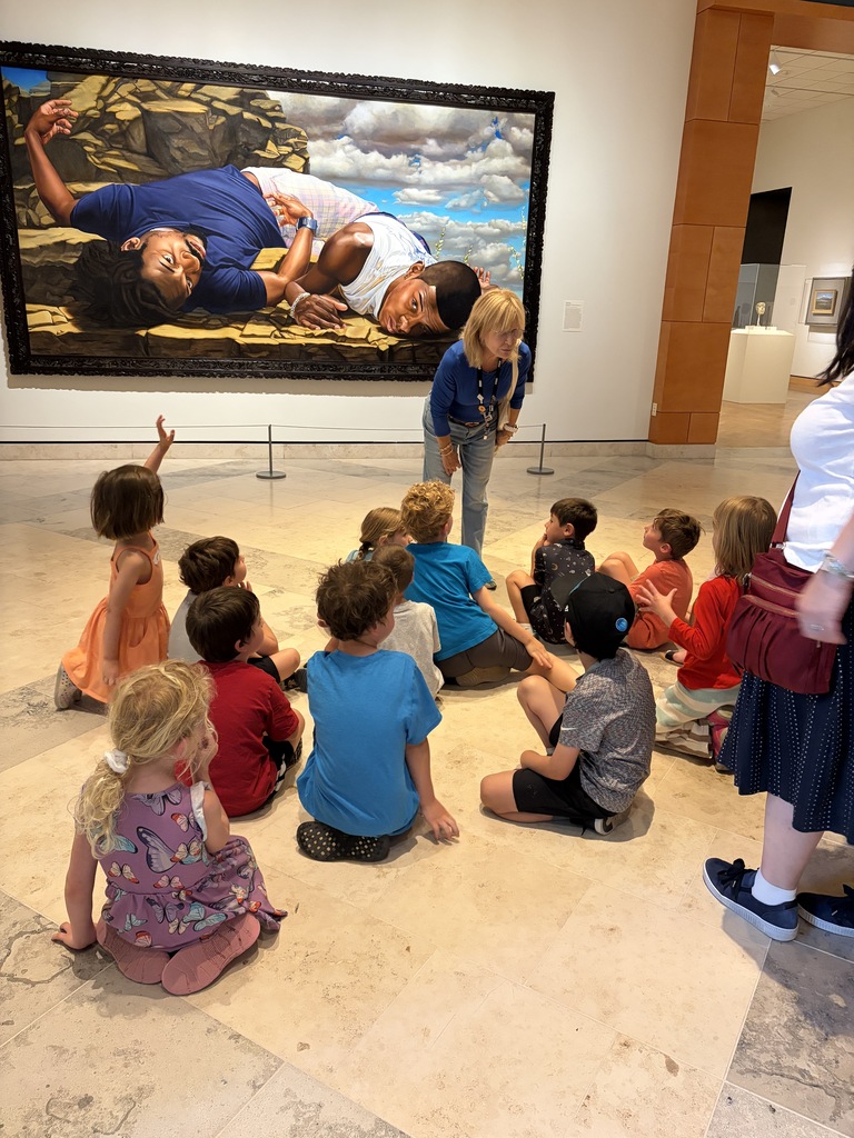 students discuss painting