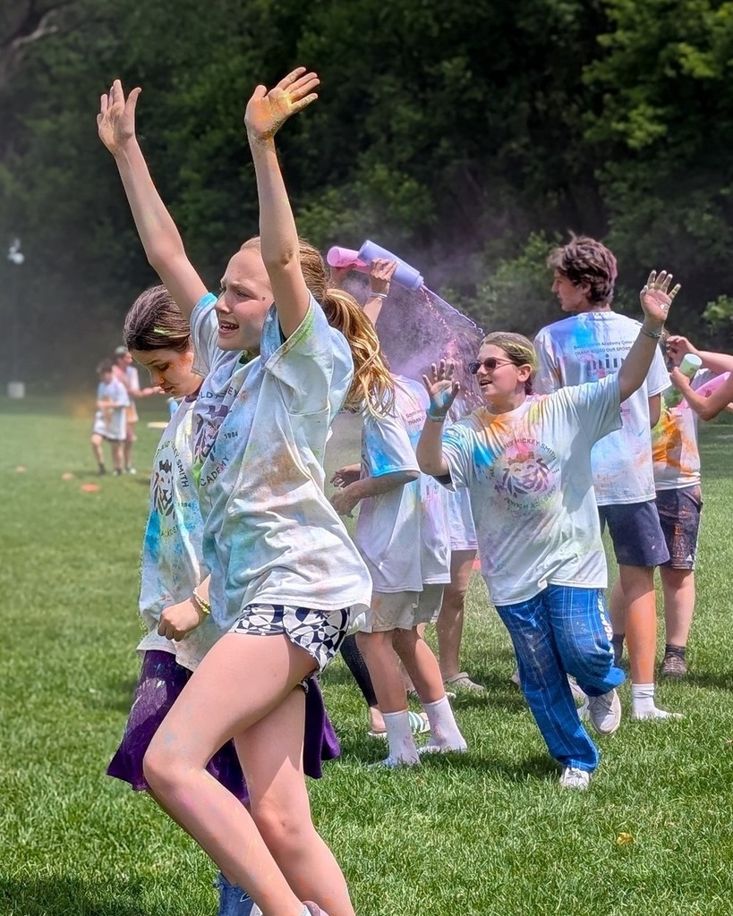 students run through colorful chalk