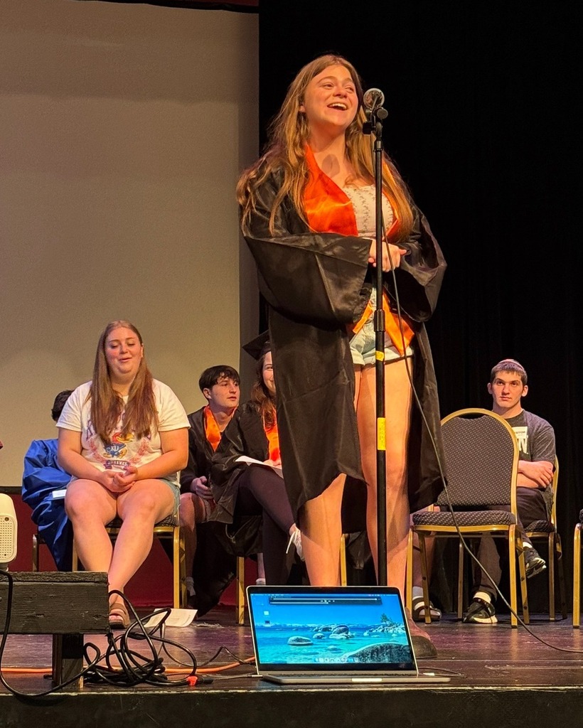 senior speaks into microphone