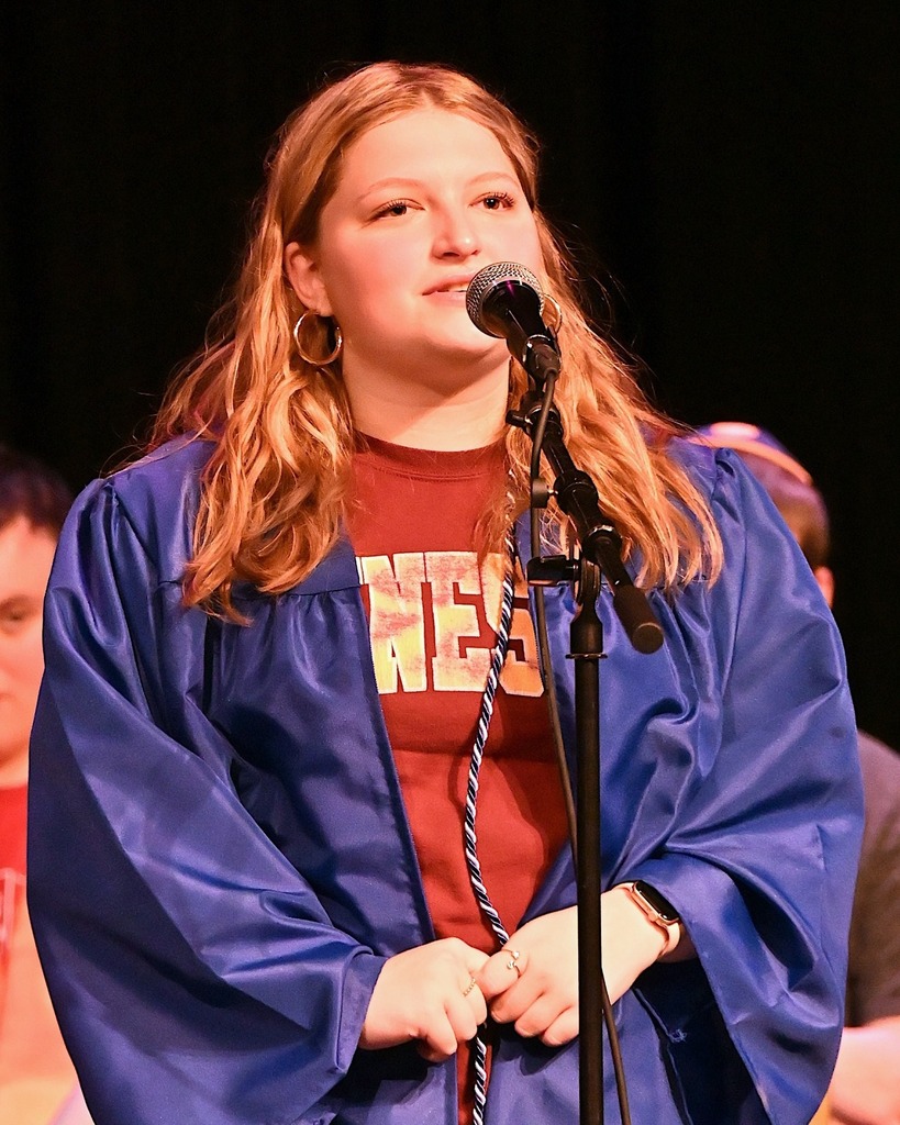 senior speaks into microphone