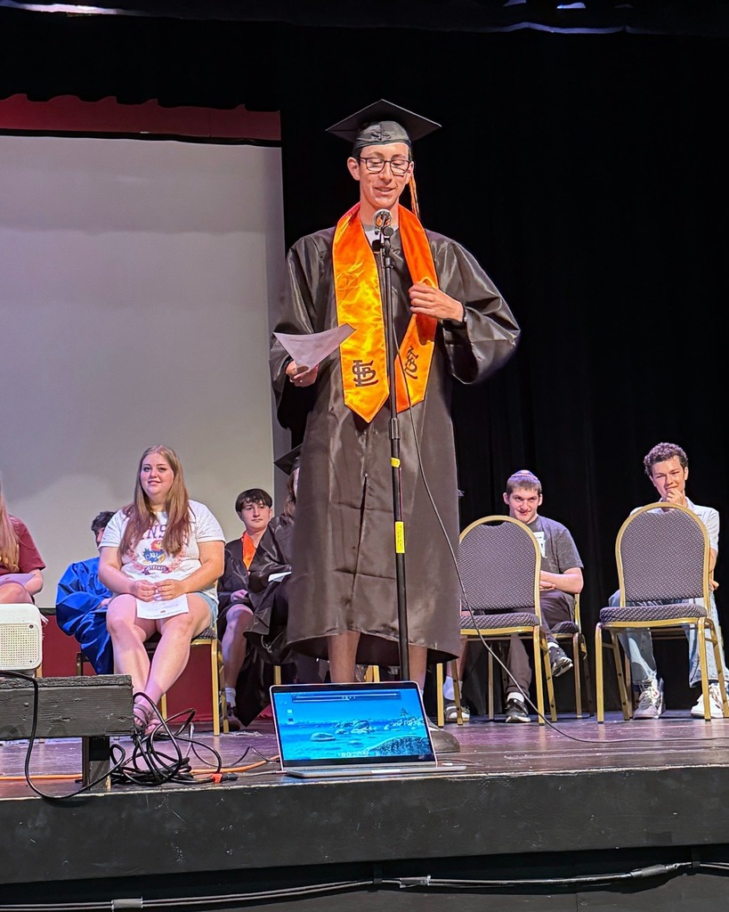 senior speaks into microphone