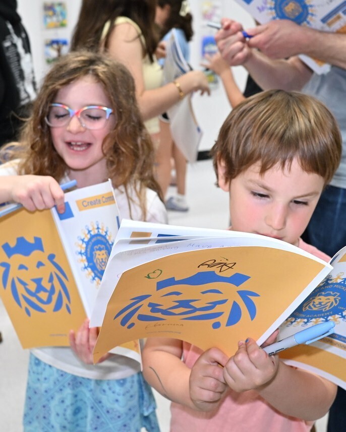 Students look at their yearbooks