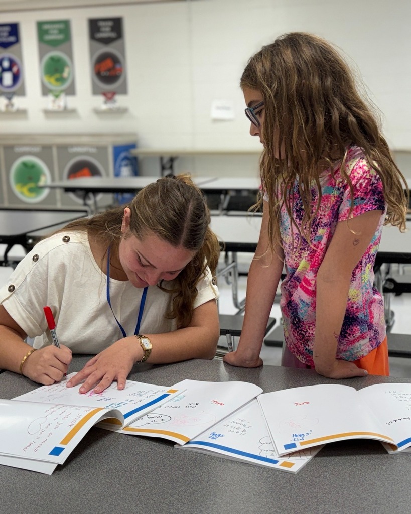 bat sherut signs student's yearbook