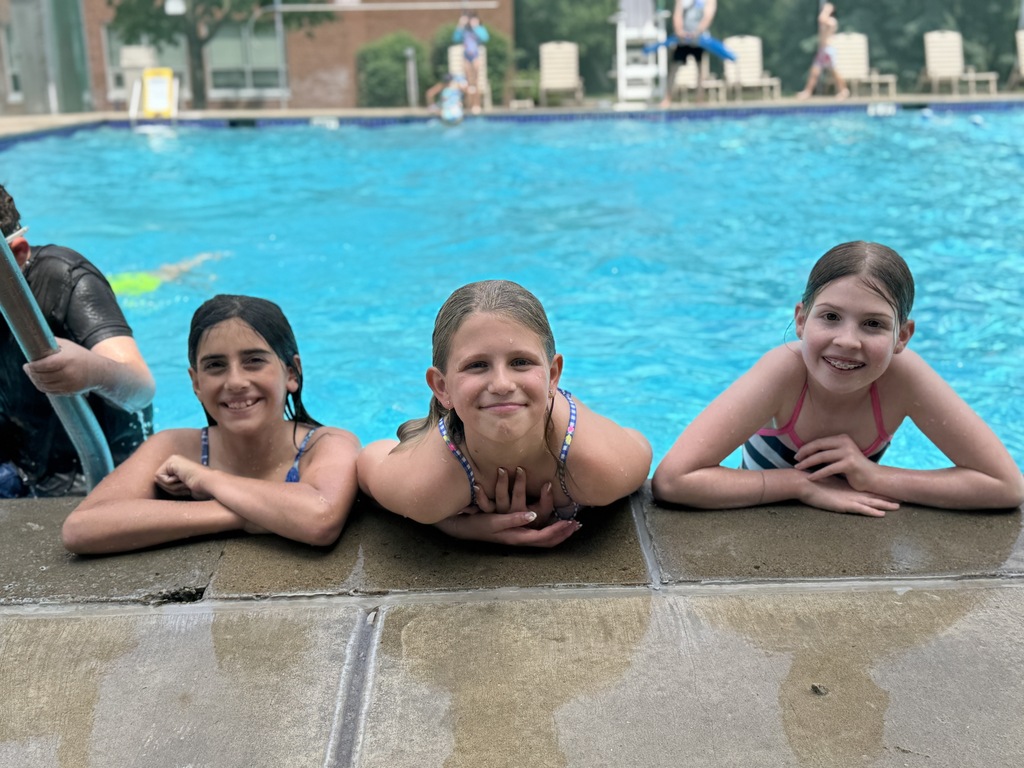 children smile in swimming pool