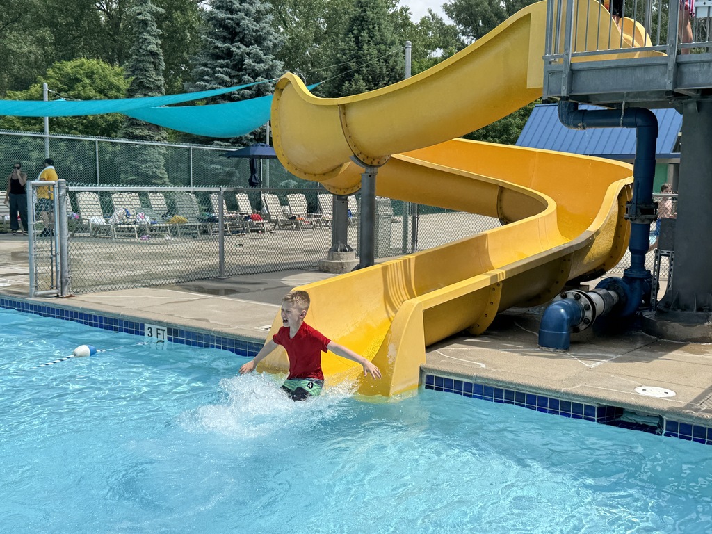 child goes down water slide 