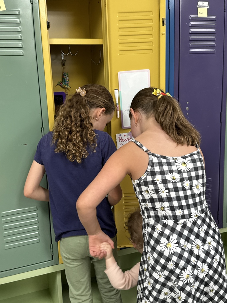 girls look into and decorate locker