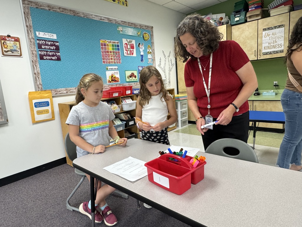 teacher goes over activity with students