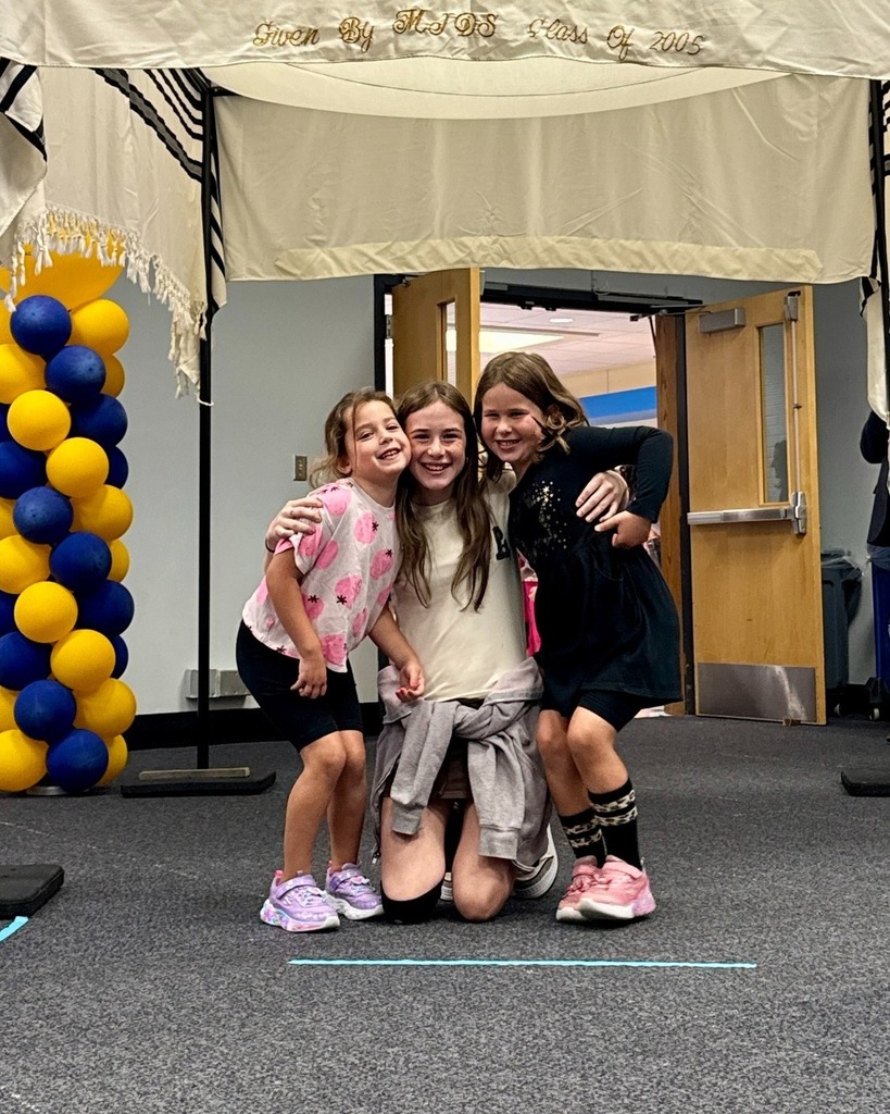 eighth grader with kindergarten buddies under chuppah