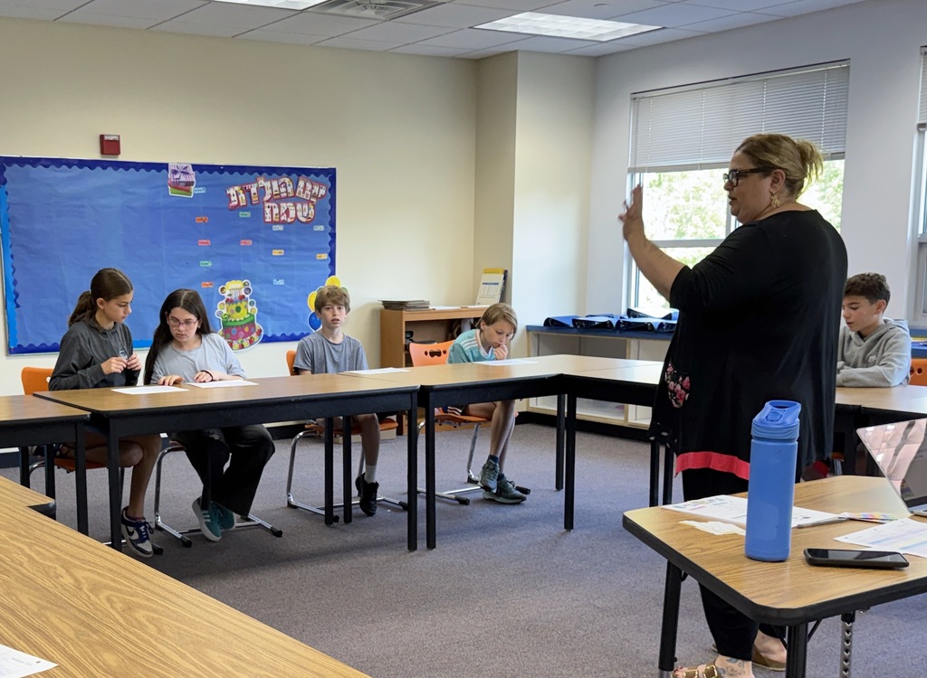 teacher instructs middle school students