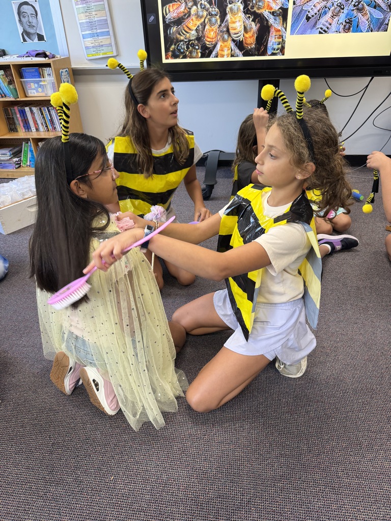 students act out bees attending to the queen bee