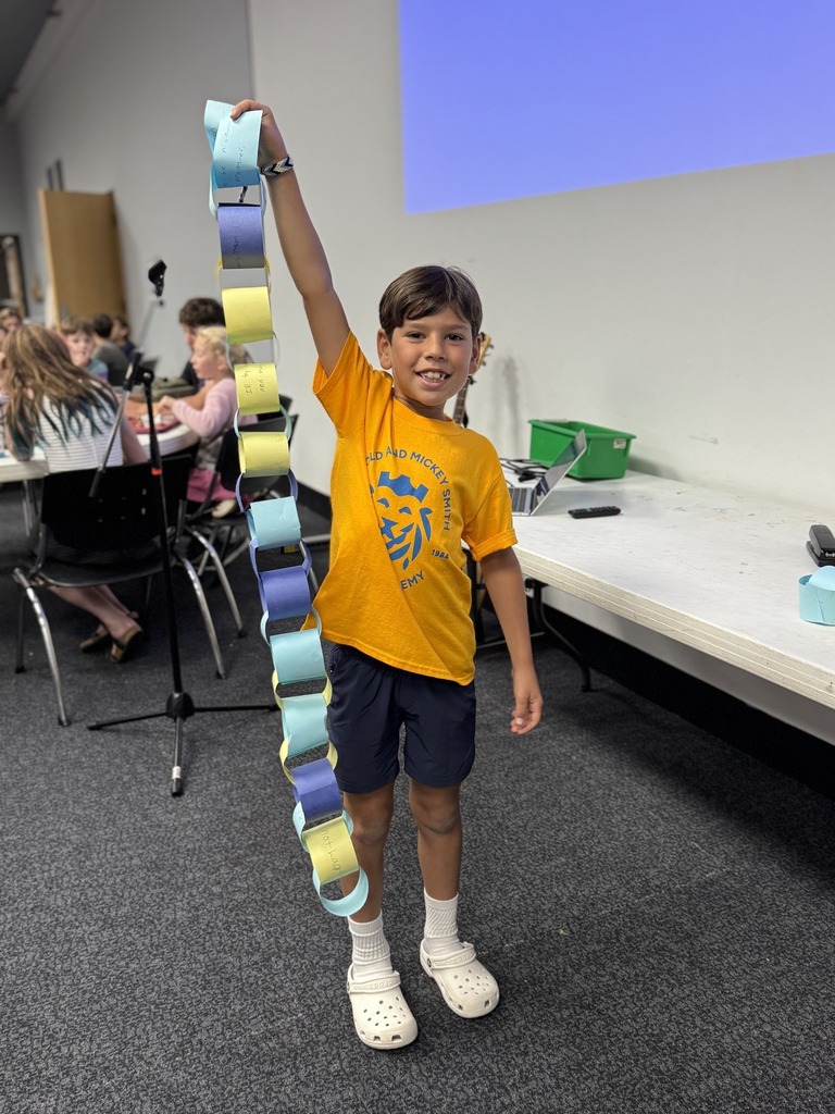 student displays paper chain section