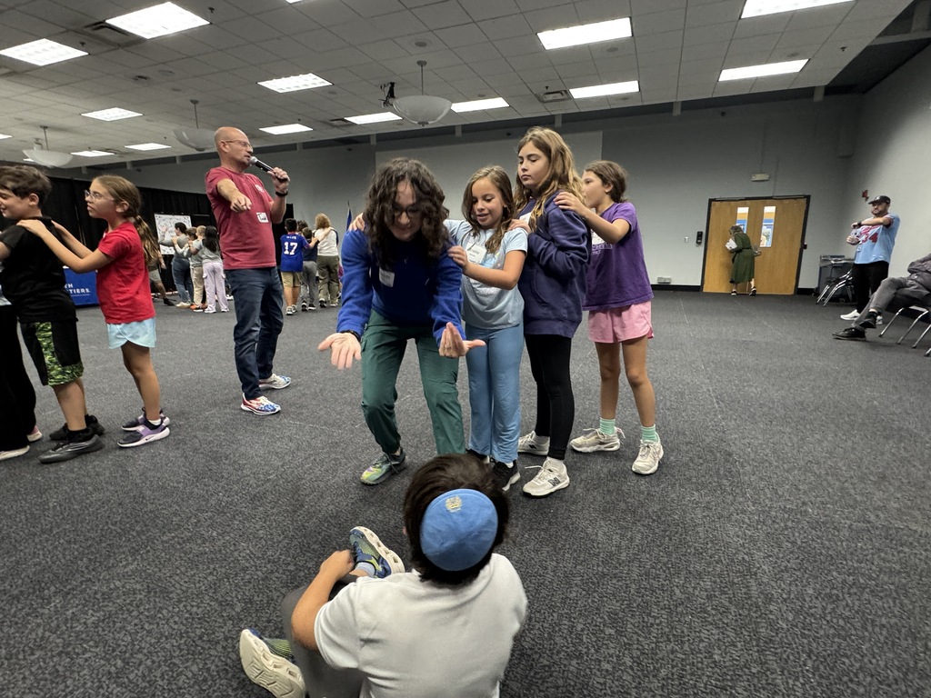 students and teachers form train