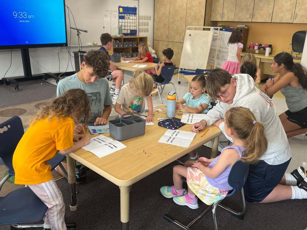 eighth graders work with kindergarten buddies