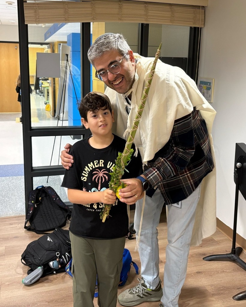 father and son with lulav and etrog