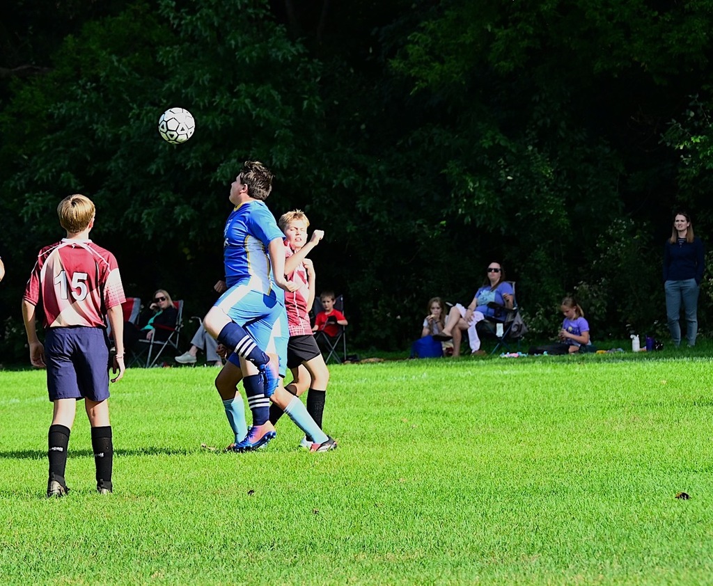 soccer players go for the soccer ball