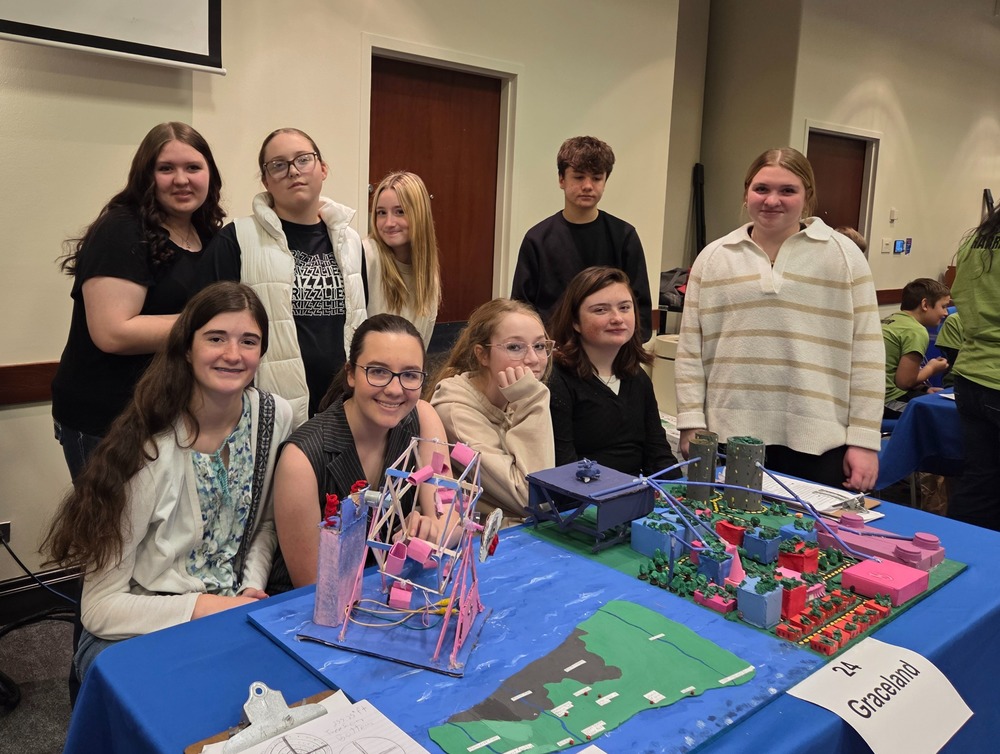 Eight eighth grade students present their futuristic city build at competition in Boise.