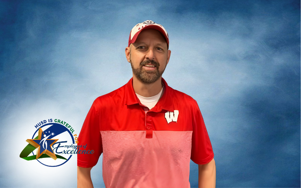 Chad Snyder Employee of the Year in Red shirt with a W on the chest.