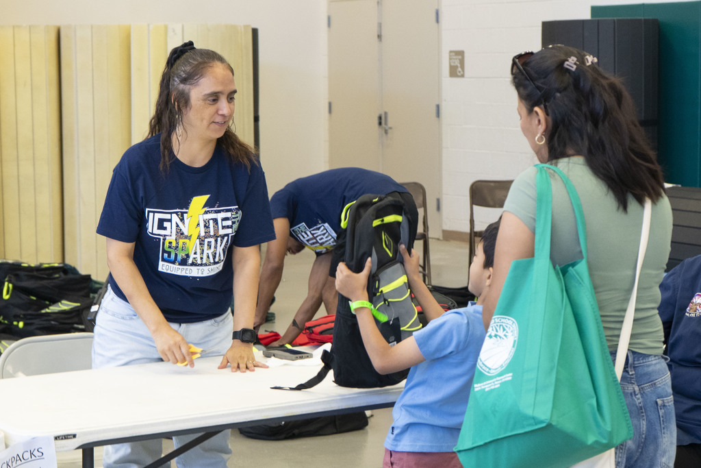 Student receives a backpack and resource fair