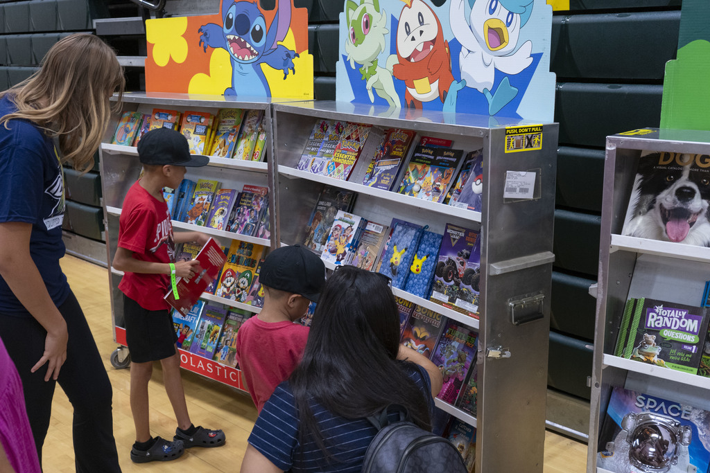 Students getting new books at resource fair