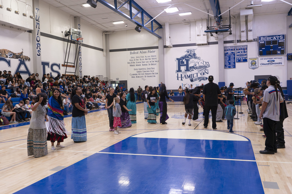 Members of local native american tribes present cultural practices and artifacts to students